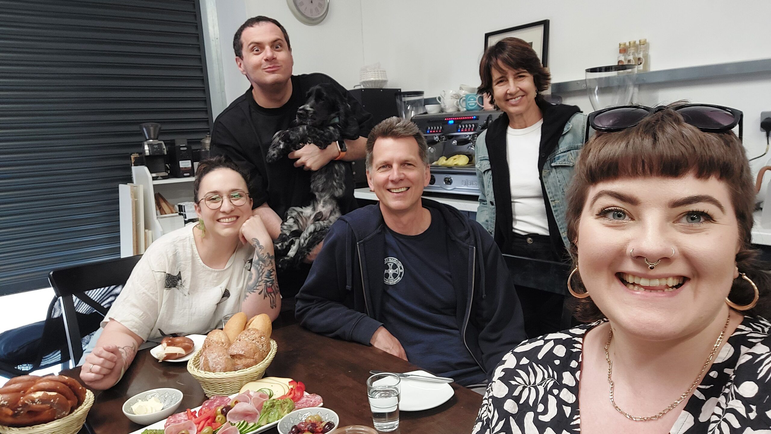 A selfie of the Durham Coffee team alongside the team from Mio Coffee who came to visit them at the coffee roastery in Durham