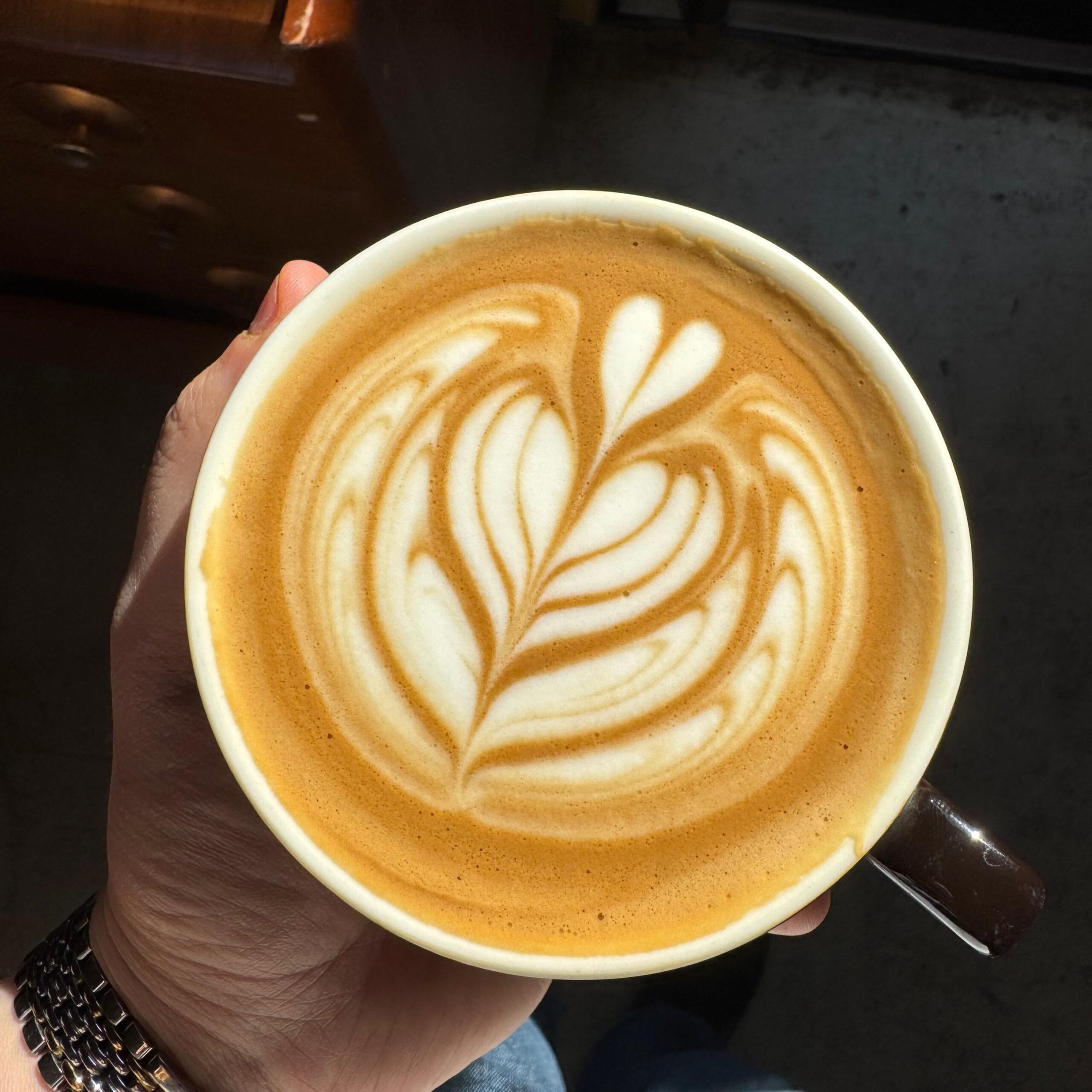 A flat white coffee cup with beautiful latte art
